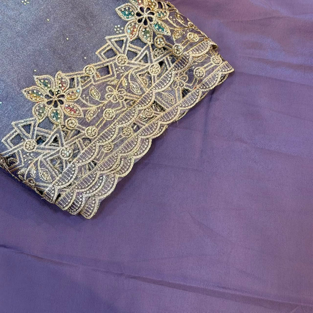 Decorative lace fabric with gold embroidery on a purple background