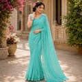 AQUA BLUE GEORGETTE SAREE WITH ALL- OVER SEQUIN WORK
