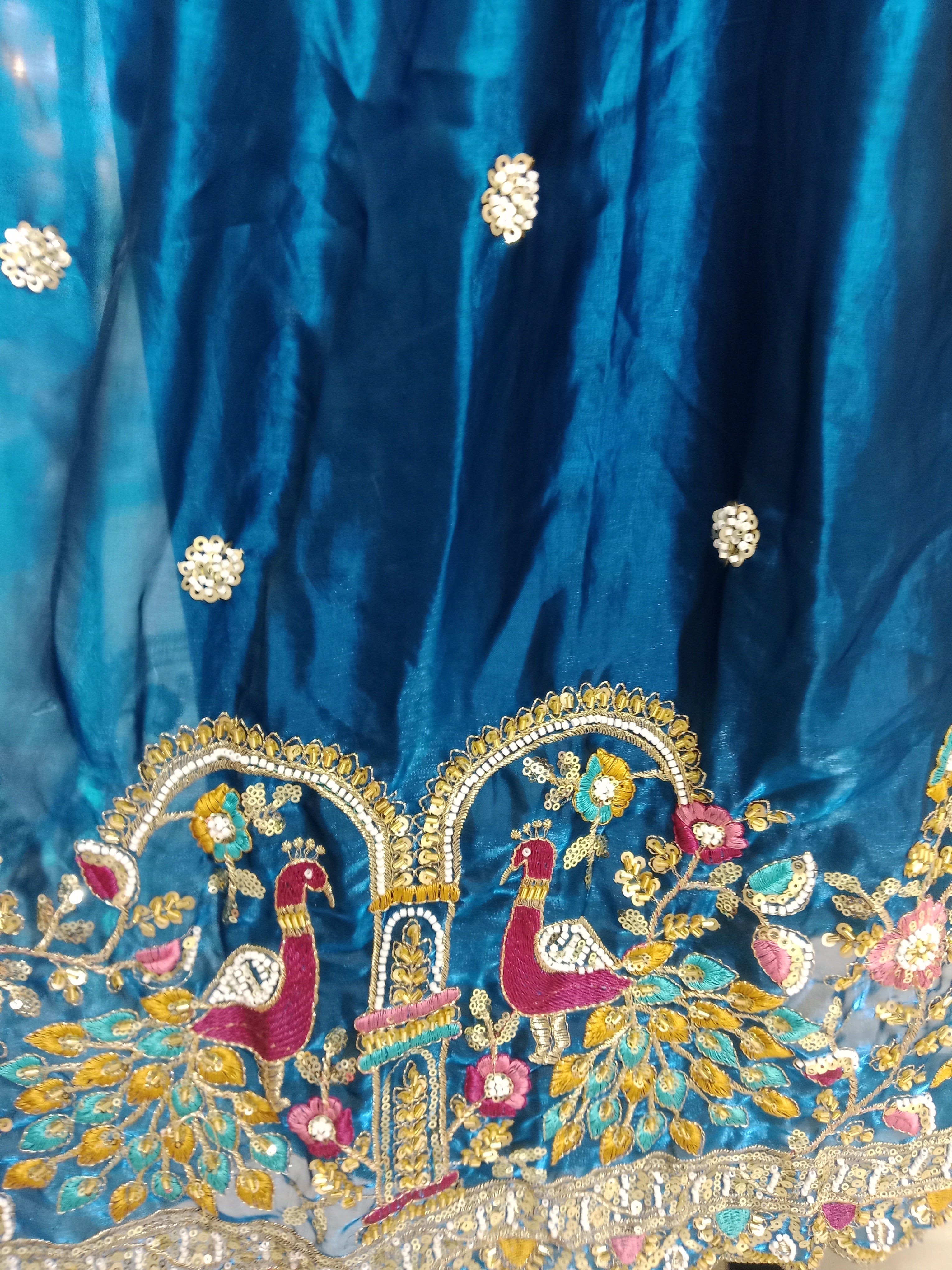 TEAL BLUE LEHENGA WITH PEACOCK+ FLORAL BORDER WORK