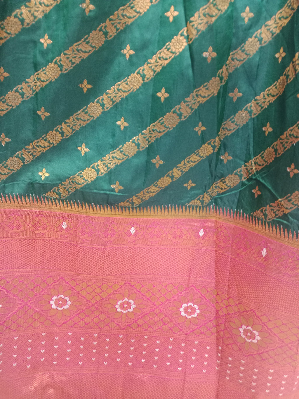 BOTTLE GREEN LEHENGA WITH GOLD ZARI  STRIPES WITH RED-ORANGE KANJIVARAM BORDER