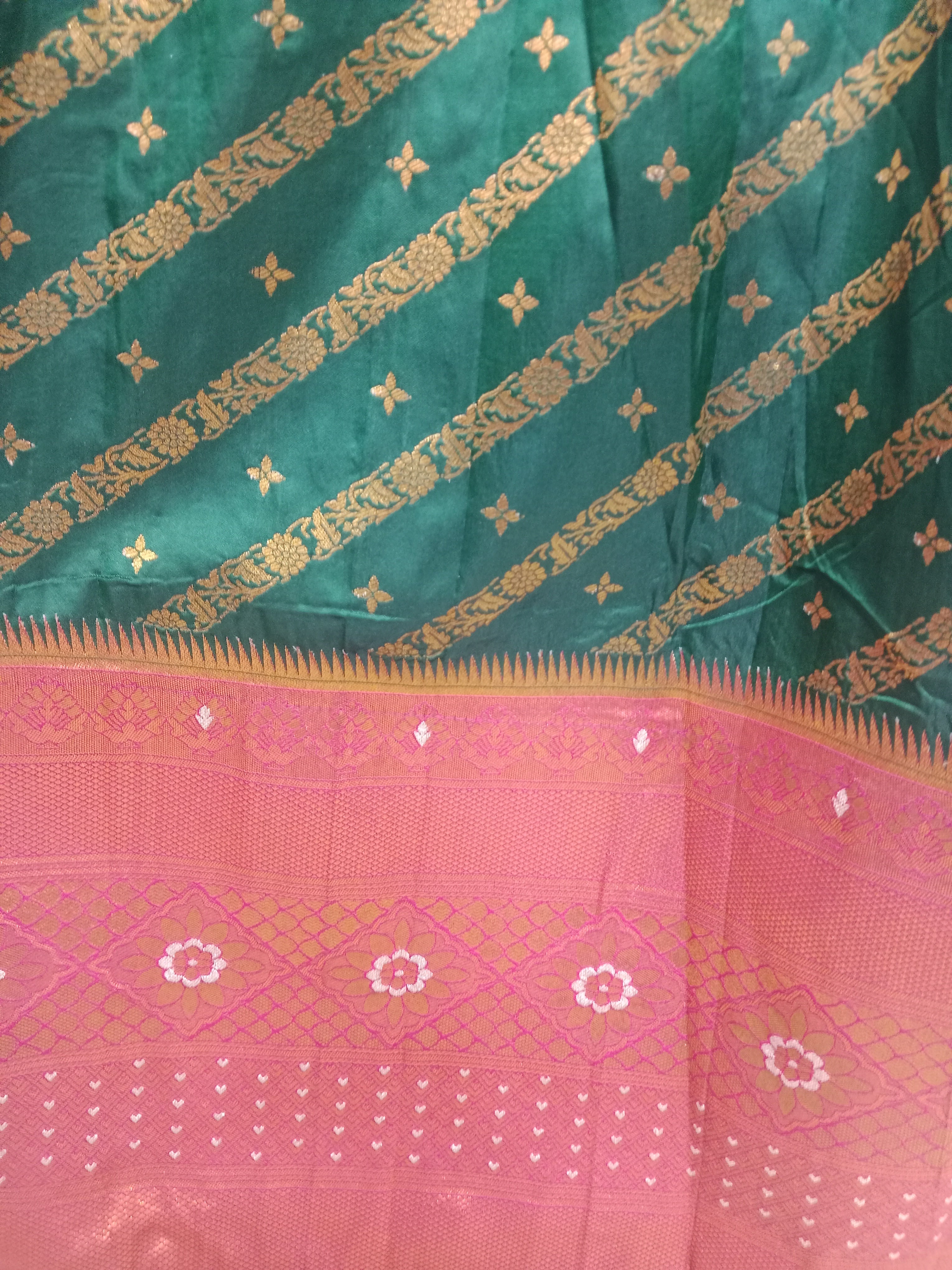BOTTLE GREEN LEHENGA WITH GOLD ZARI  STRIPES WITH RED-ORANGE KANJIVARAM BORDER